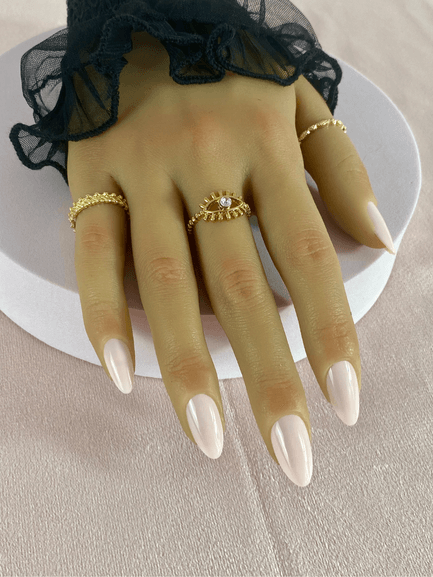 Faux ongles réutilisables, beige, en forme amande et finition brillante.