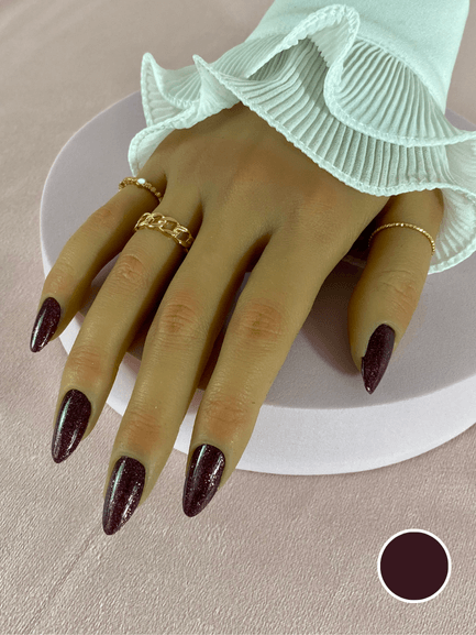 Faux ongles réutilisables à coller à l'aide d'adhésifs, couleur violet foncé pailleté, en forme d'amande, avec une finition brillante.