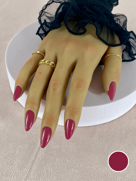 Faux ongles réutilisables à coller avec des adhésifs, couleur rose fuchsia, en forme d'amande, avec une finition brillante.